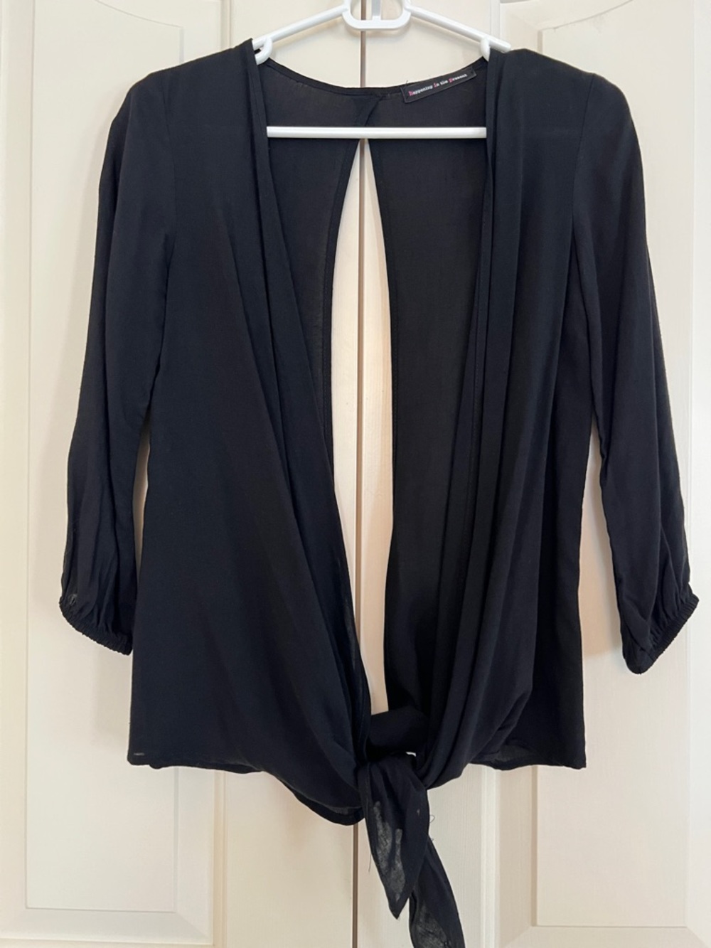 happening in the present Black Tie-Front Blouse
Size XS